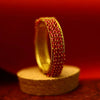 Matte gold bangles with orange beads